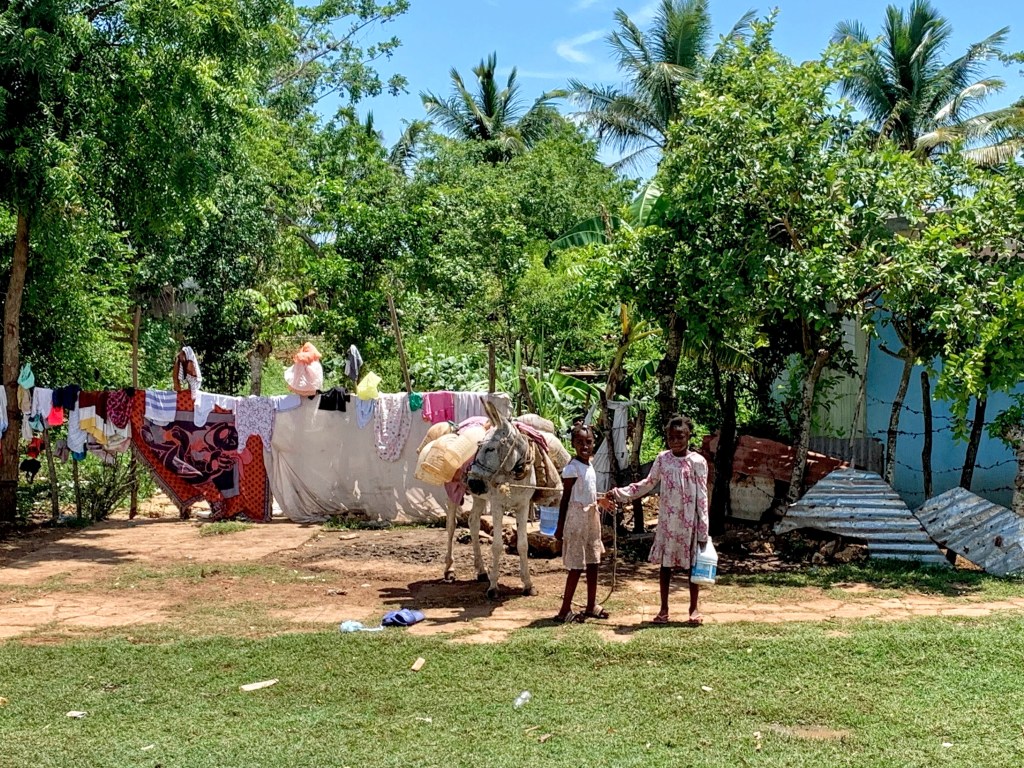 Two gals and a donkey.  :)